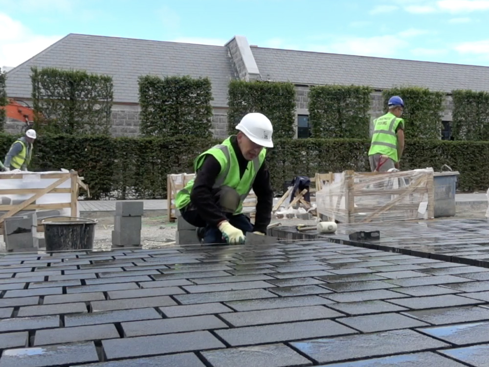 Premier Paving Contractors UK - crew laying paving brick